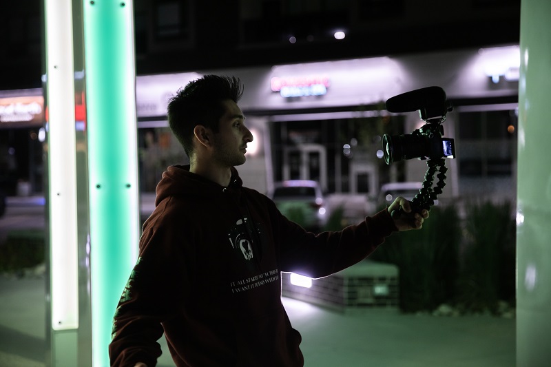 man holding a vlogging camera