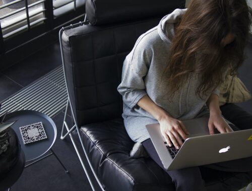 girl using her laptop at home